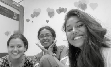Three friends smiling